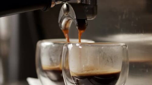 Pouring A Coffee Jet From A Professional Machine Into A Cup