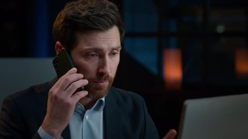Close Up Adult Middleaged Caucasian Businessman Worker Man Sit at Office Desk Talking Mobile Phone