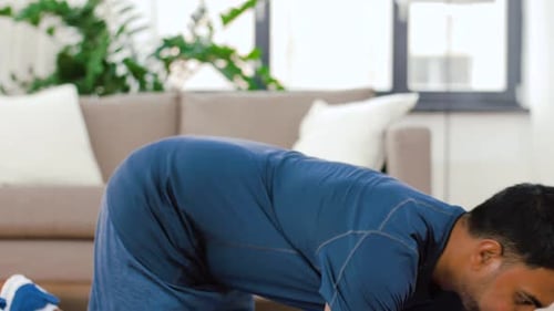 Sport, Technology and Healthy Lifestyle Concept - Indian Man Using Fitness Tracker