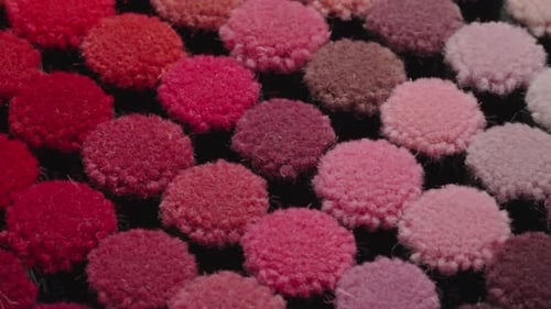 Collection of colorful carpet pile samples on tray moving in isometric view. Close up view. Textile