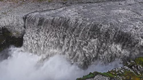 Aerial View of Dettifoss Waterfall Cascading Into a Rocky Canyon