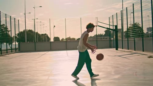 Involved Teenager Bounce Ball at Stadium