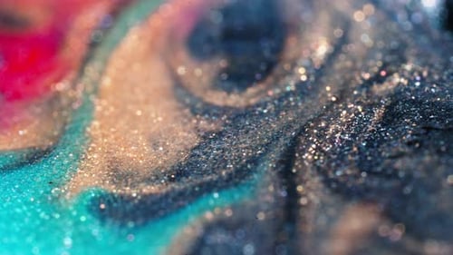 Abstract liquid patterns swirl together in a mesmerizing display of color and organic shapes