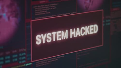 Monitor de computadora que muestra un mensaje de alerta del sistema pirateado que parpadea en la pantalla