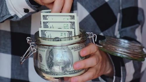 Dollar Banknote Saving Money in Glass Jar Unrecognizable Woman Moderate Consumption and Economy