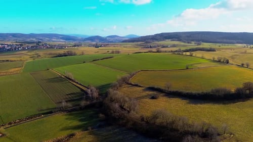 Aerial Panorama of Varied Farmlands Nestled in a Tranquil Valley