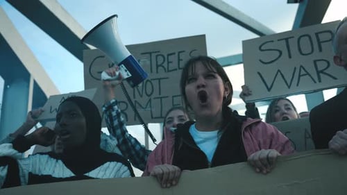 Diverse Group Protesting Against War in Urban Setting