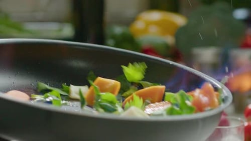 Fresh Vegetables Flaming in a Pan for Cuisine