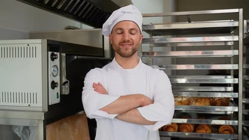 Portrait of a Baker in Bakery with Bread and Croissant