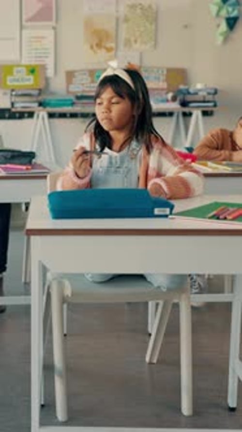 School, thinking and girl in classroom for writing, education and creative lesson for child