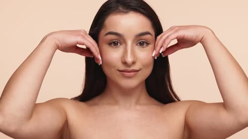Gentle Touch on Face Showcasing Healthy Clean Skin