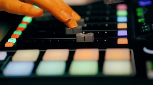 Audio Mixer Knob Adjustment in Podcast Studio