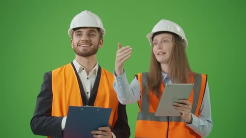 Male and Female Civil Engineers Discussing Project Work with Interest