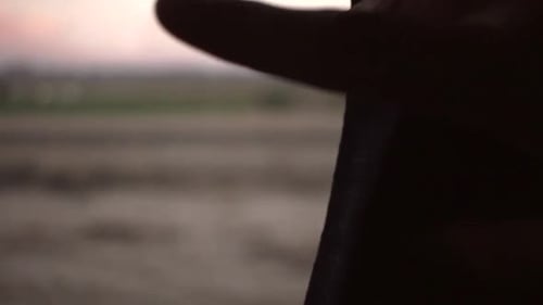 hand moving curtain of amtrak window