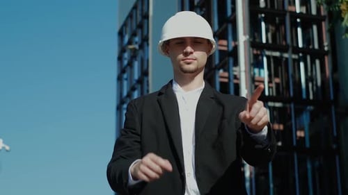 Engineer in Hardhat Interacting With Virtual Interface