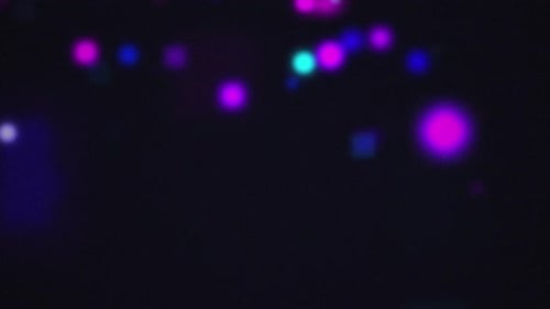Abstract Glowing Particles Seamless Loop Background