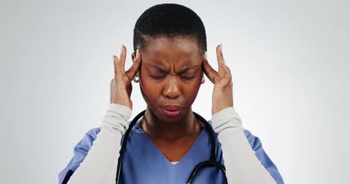 Stress, black woman and doctor with headache in studio for burnout, anxiety