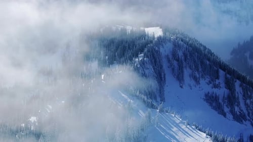 Paradise Heaven Winter Range Landscape Flying Through Clouds Above Mountain
