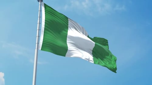 Nigeria Flag Waving in Clear Blue Sky