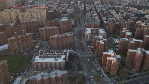 Aerial view overlooking the East Houston Street, sunset in NYC, USA - tilt, drone shot