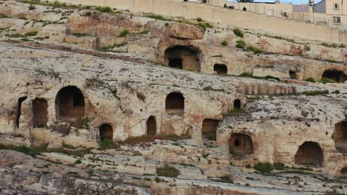 Aerial view of the two thousand year old rock tombs. Roman Rock Tombs. Sanlıurfa. 4K.