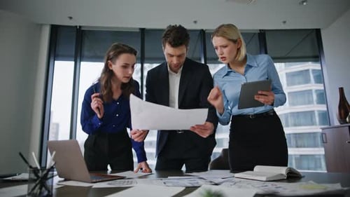 Corporate Coworkers Reviewing Business Project at Office Meeting Closeup