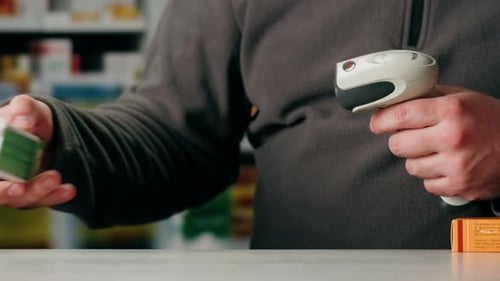 Scanner Scan Delivery Box in Pharmacy Drug Store Storage Ecommerce Shop Man Packing Goods and