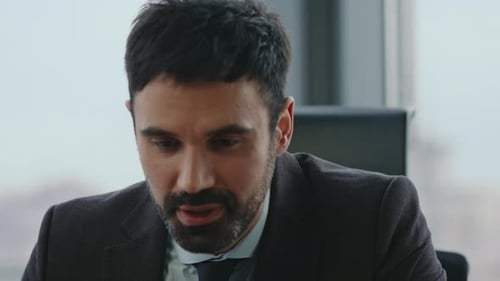 Portrait Successful Businessman Talking at Video Conference Sitting Office