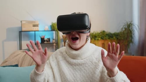 Woman Wearing VR Headset on Couch in Living Room