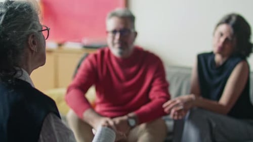 Psychologist Offering Advice to Married Couple during Therapy Session