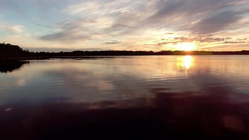 Aerial Over Beautiful Lake At Sunset