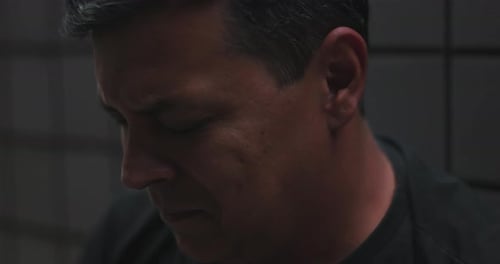 Man Looking Down in Close Up