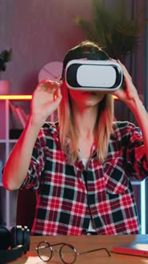 Woman Wearing VR Headset Interacting with Virtual Reality