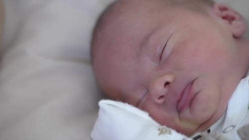 Little newborn baby sleeping. Close up small cute newborn baby.