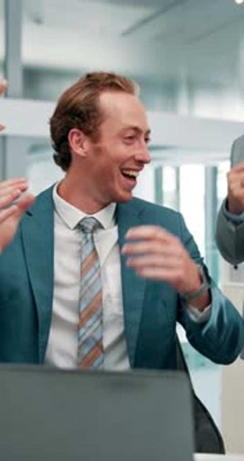 Man, laptop and high five with money rain in office, team and success with dividend results