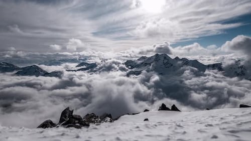Timelapse winter scenery with moving clouds and blue sky. Glacier and mountains in South Tyrol.
