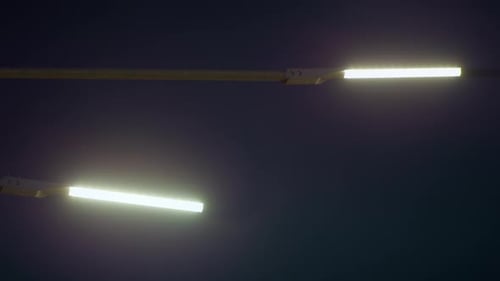 City Street Lamp Post Illumining Roadway Night Close Up. Modern Bright Led