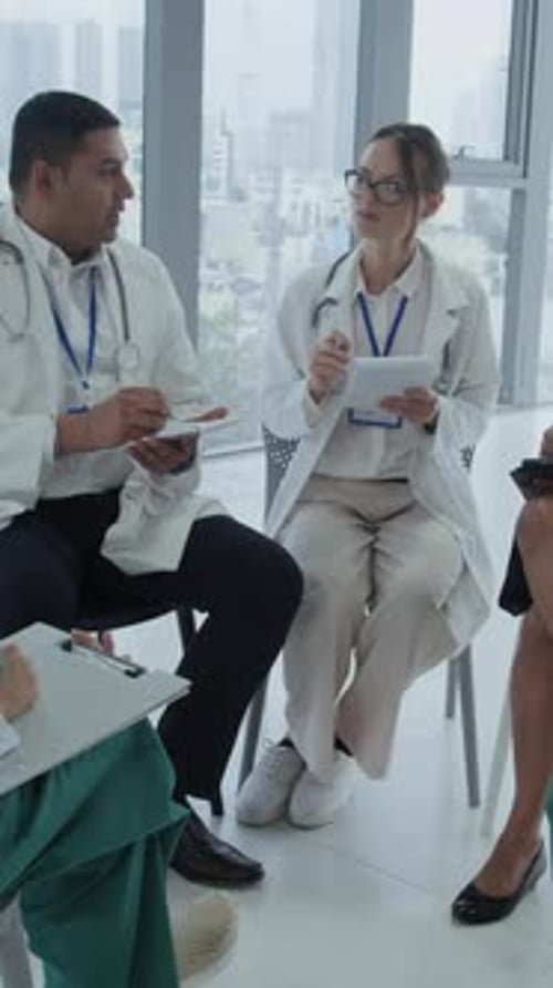 Diverse Healthcare Workers Having Meeting at Hospital