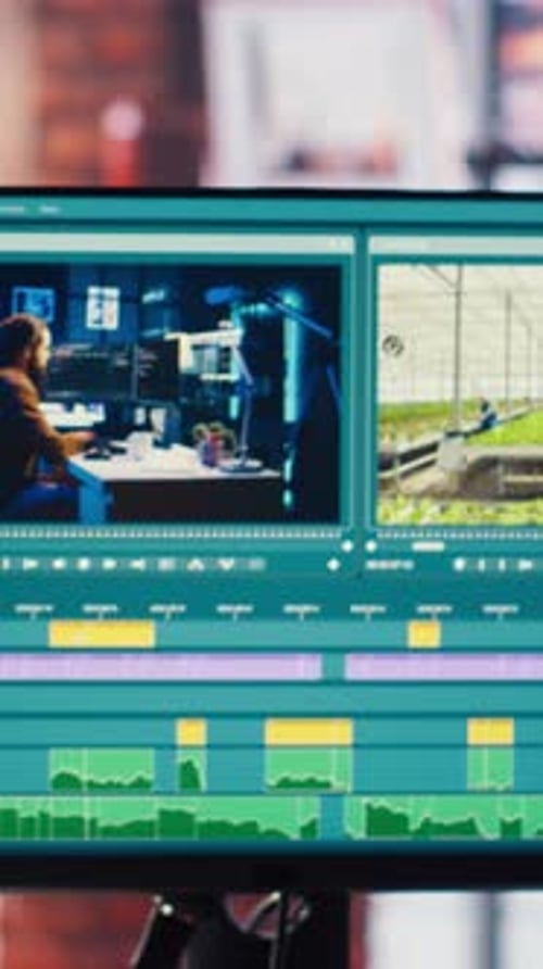 Video Editor Wearing Headphones to Polish Raw Footage and Improve Audio Quality