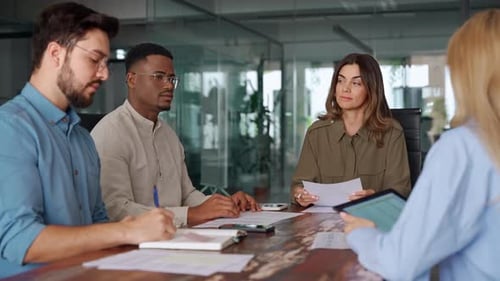 Professionals Collaborate in Modern Office Meeting