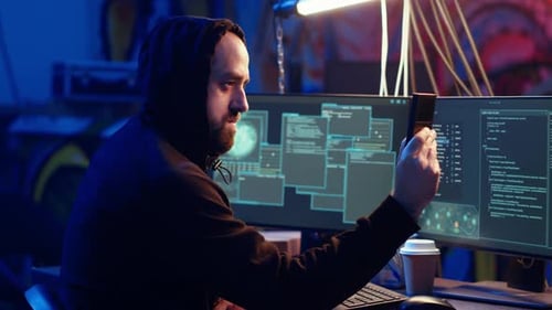 Man Coding Late at Night in Urban Workplace