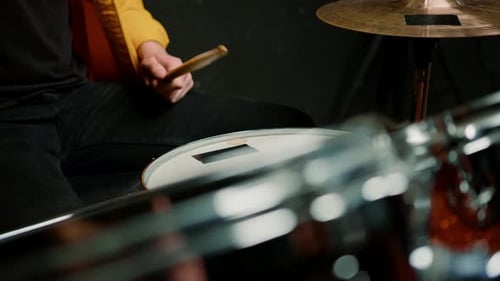 drummer plays a drum kit in a recording studio at a professional musician rehearsal recording a song