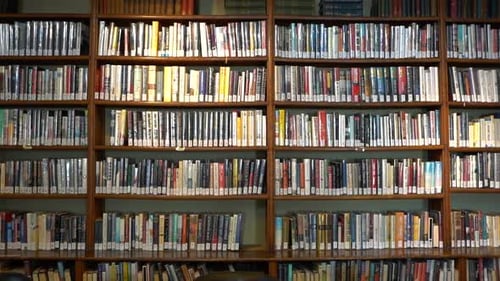 Panning shot of a library bookcase