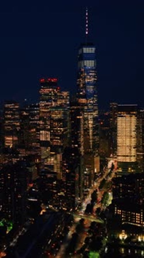 Vibrant New York with billions of lights. Drone footage descending above the night cityscape
