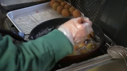 Delicious Falafel Cooking in Frying Pan Close Up
