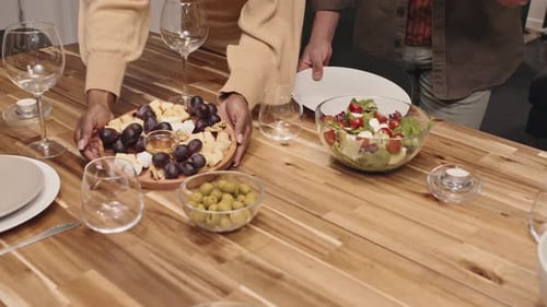 Gourmet Appetizers Placed on Wooden Dinner Table
