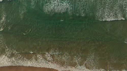 Aerial view of ocean waves crashing, Spain.