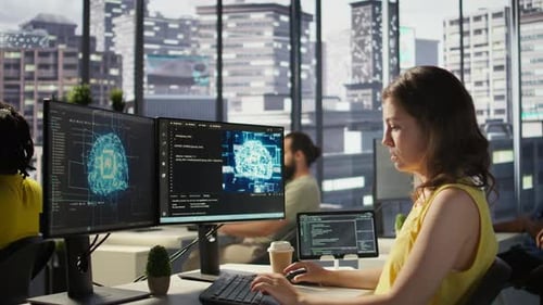 Woman Coding at Desk in Modern Office