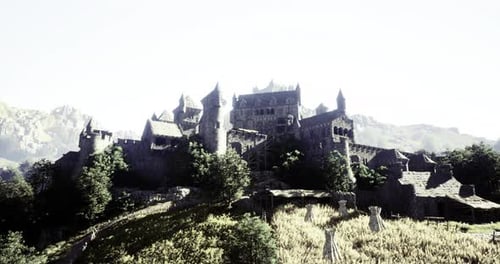 Majestic Ancient Castle on a Hill Surrounded By Lush Greenery