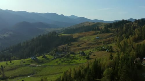 Lonely Buildings Mountain Valley View Beautiful Green Rocky Peaks Sky Background. Stunning Nature...